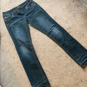 Ripped dark denim jeans.